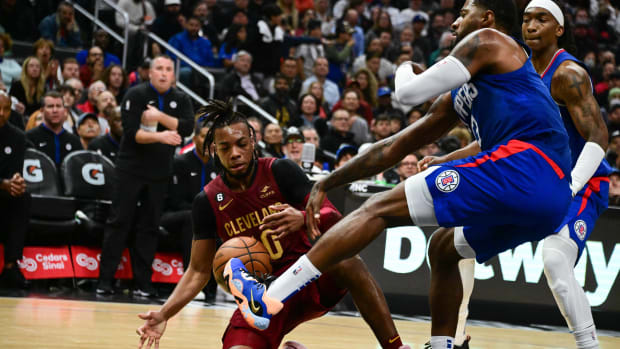 Cleveland Cavaliers guard Darius Garland (10) and Los Angeles Clippers guard Paul George (13) battle for the ball in the third quarter at Crypto.com Arena.